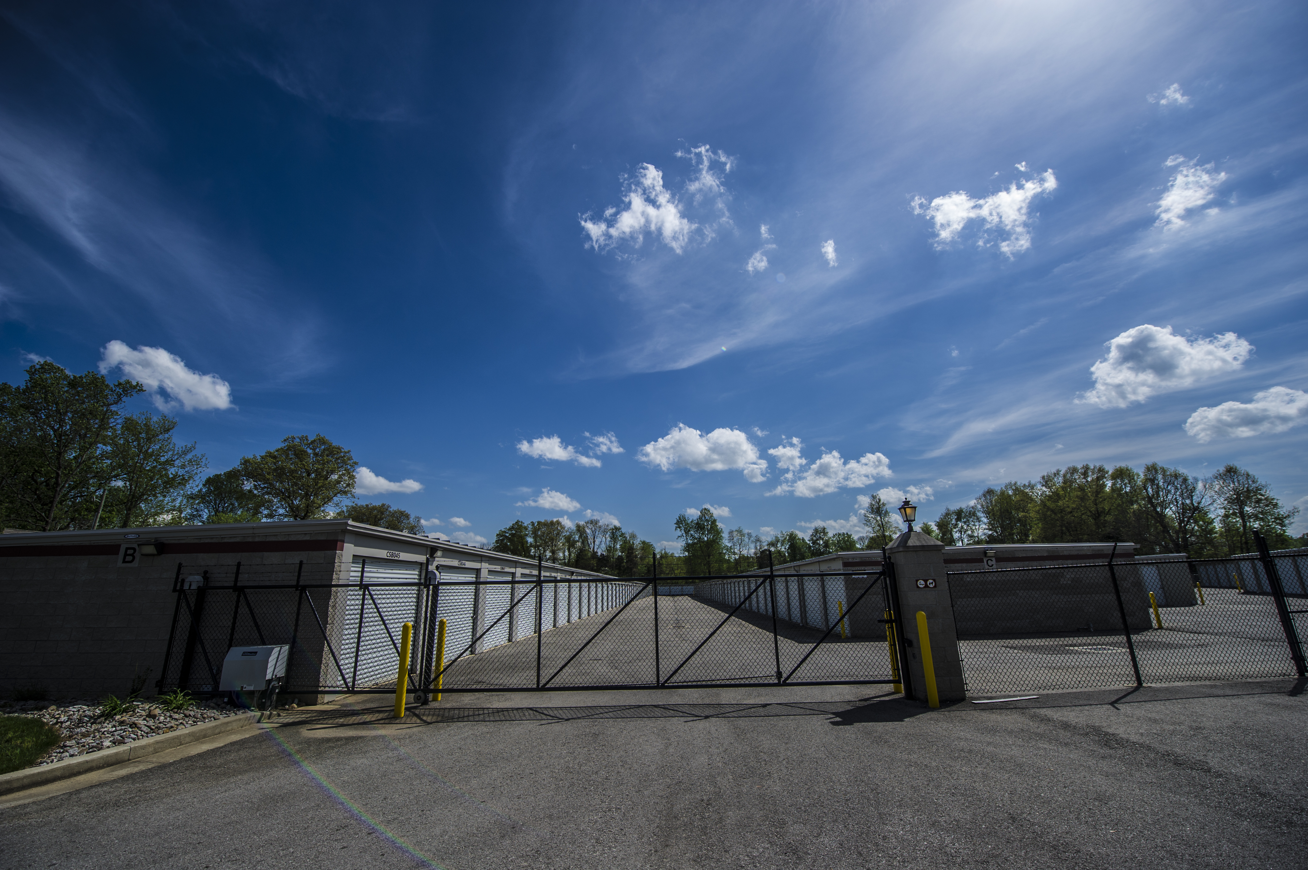 Budd Road Access Storage facility showcasing white doors, secure gated entry, and spacious driveways for easy access.